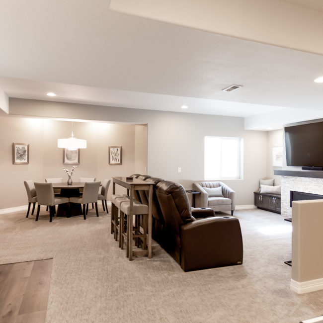 Basement with large tv area, kitchenette, and dining area